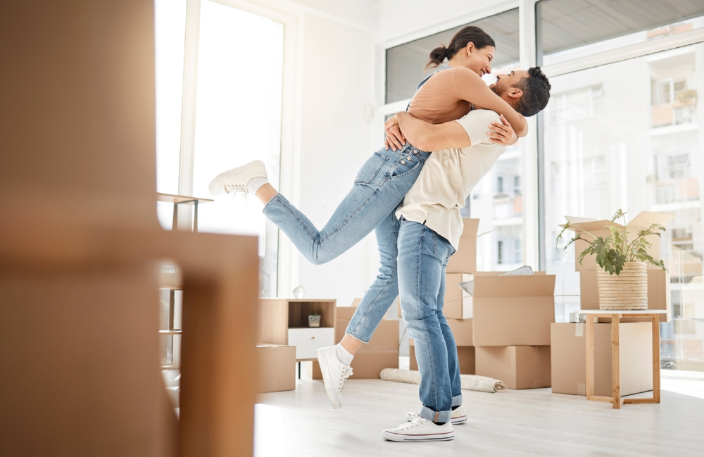 Man and woman unpacking home