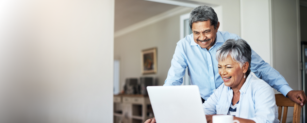 Older couple looking at laptop